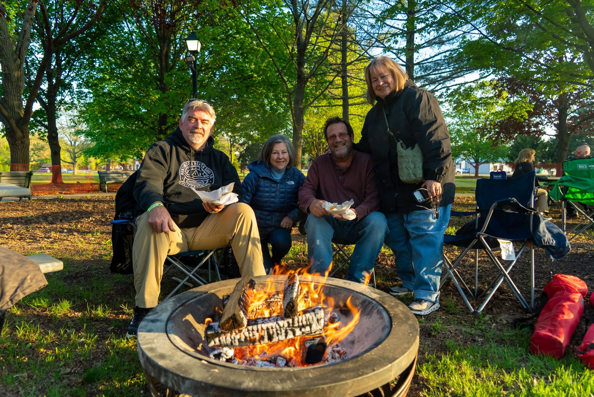 Four people by firepit at Bonfire & Brews Spring 2026 event. Photo courtesy of Gurnee Park District.